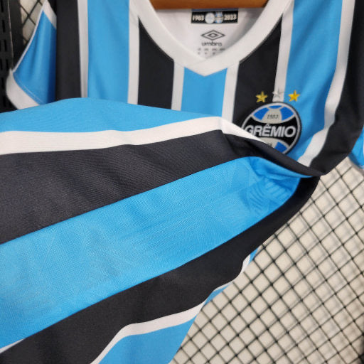 Camisa Grêmio Home 23/24 - Umbro Versão Feminina